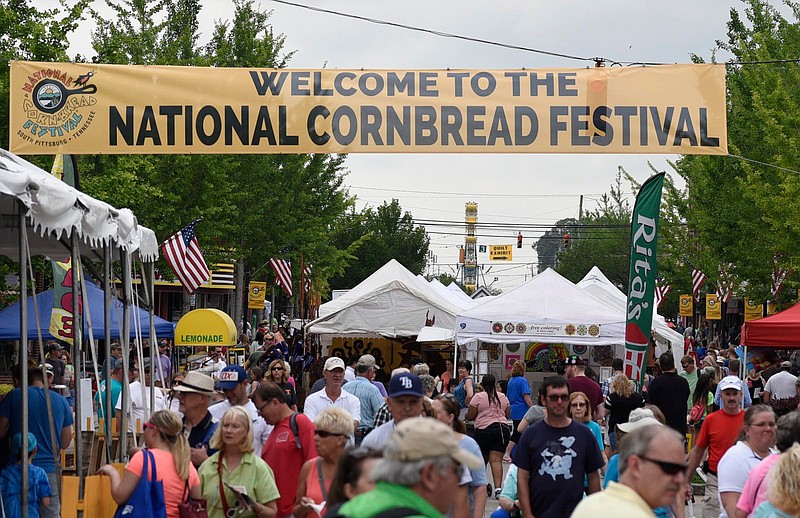 Staff Photo by Robin Rudd / South Cedar Aveneue in South Pittsburg becomes the boardwalk during the final day of the National Cornbread Festival in 2017.