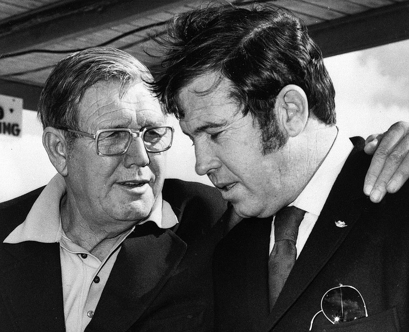 AP file photo / Bill France, left, and his son Bill Jr. talk on Jan. 11, 1972, in Daytona Beach, Fla., where NASCAR was born 75 years ago and where another Cup Series season will kick off Sunday with the 65th running of the Daytona 500.