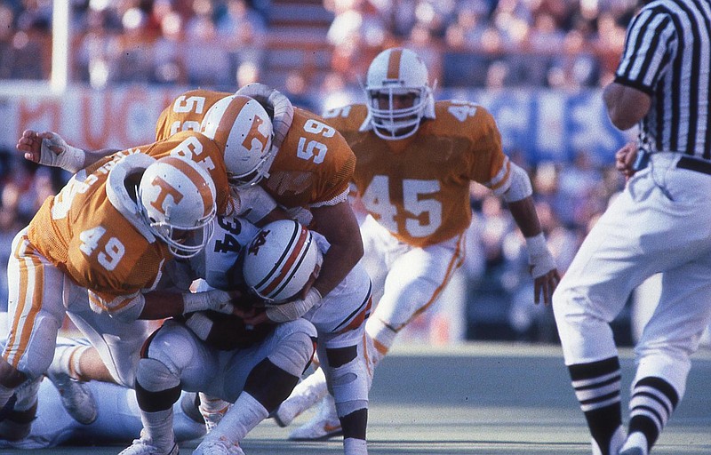 Tennessee Athletics photo / Linebacker Kelly Ziegler (49) and defensive tackle Mark Hovanic (59) wrap up Auburn running back Bo Jackson during Tennessee's 38-20 win over top-ranked Auburn in 1985.