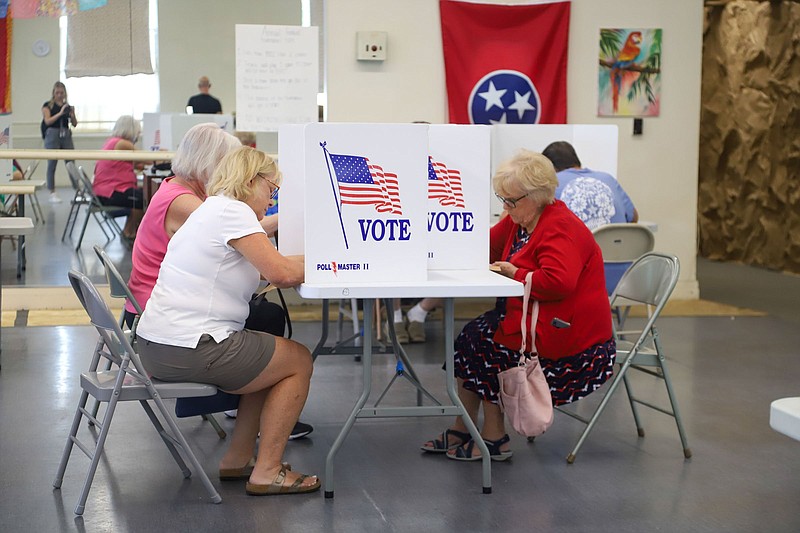 Staff File Photo By Olivia Ross  / State and federal primary voters mark their ballots at the John A Patten Recreation Center on Aug. 4, 2022.