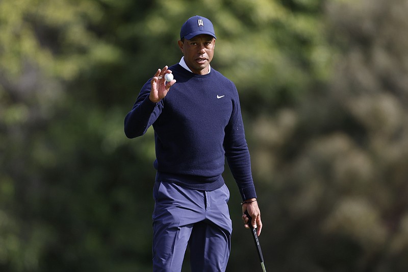 AP photo by Ryan Kang / Tiger Woods acknowledges the gallery on the ninth hole at Riviera Country Club during the first round of the PGA Tour's Genesis Invitational on Thursday in Los Angeles.