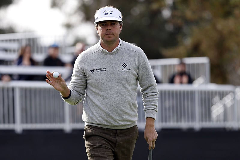 AP photo by Ryan Kang / Keith Mitchell acknowledges the gallery on the 17th green at Riviera Country Club during the second round of the Genesis Invitational on Friday in Los Angeles.