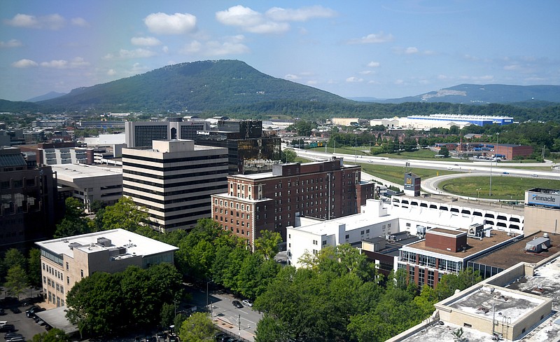 Staff Photo by Robin Rudd / Some of downtown's Chattanooga major buildings are seen from the 18th floor of the Truist Building in May 2022, with Lookout Mountain in the background.