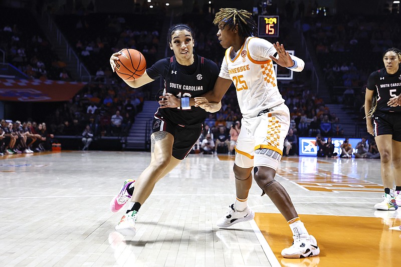 AP photo by Wade Payne / South Carolina's Brea Beal drives as Tennessee's Jordan Horston defends during Thursday night's SEC matchup in Knoxville. Beal helped the undefeated, top-ranked Gamecocks to a 73-60 victory.