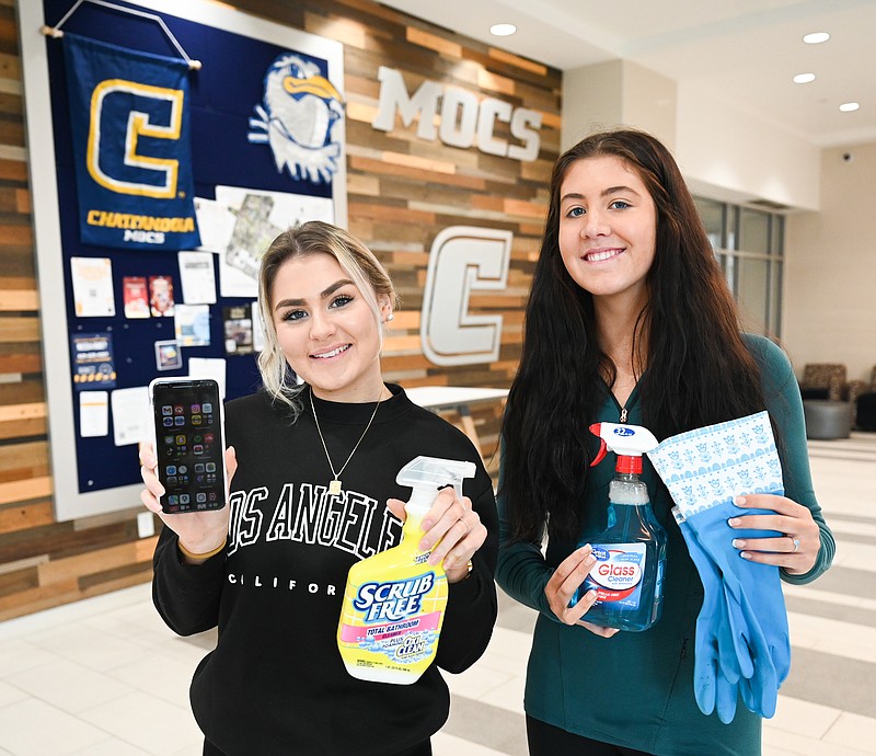 Angela Foster / University of Tennessee at Chattanooga / Alayna Grover, left, and Brooke McFarlin stand Jan. 26 in West Campus housing. The pair plan to develop a business through an app that will assist college students in finding other college students to hire for various tasks, such as cleaning.