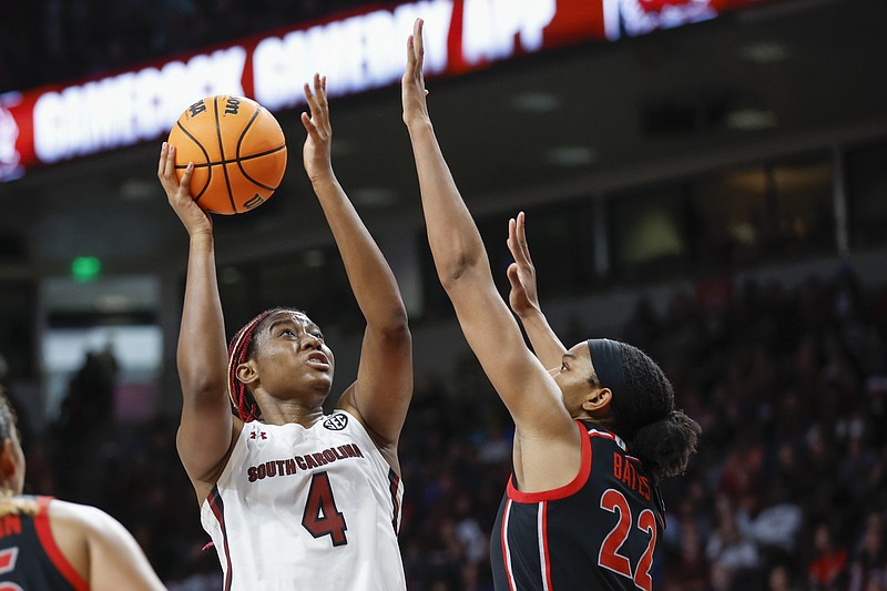 AP photo by Nell Redmon / South Carolina forward Aliyah Boston shoots as Georgia forward Malury Bates defends during Sunday's game in Columbia, S.C. Boston had 25 points and 11 rebounds as the Gamecocks finished the regular season 29-0.