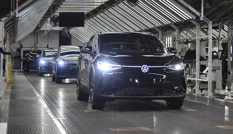 Staff Photo by Matt Hamilton / Vehicles roll off the line Oct. 14 during the launch celebration for the Volkswagen ID.4 electric SUV at the Chattanooga Volkswagen assembly plant.