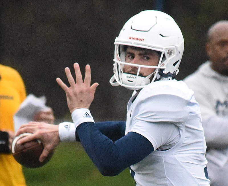 Staff photo by Matt Hamilton / UTC's (9) Chase Artopoeus fires a pass from the pocket during a UTC football practice at Scrappy Moore Field on Wednesday, February 15, 2023.