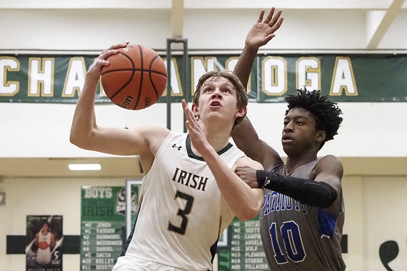 Staff photo / Notre Dame's Cole McCormick (3) is fouled by Arts & Sciences' Justin Brown during a January 2021 game at Notre Dame's Phifer Gymnasium.