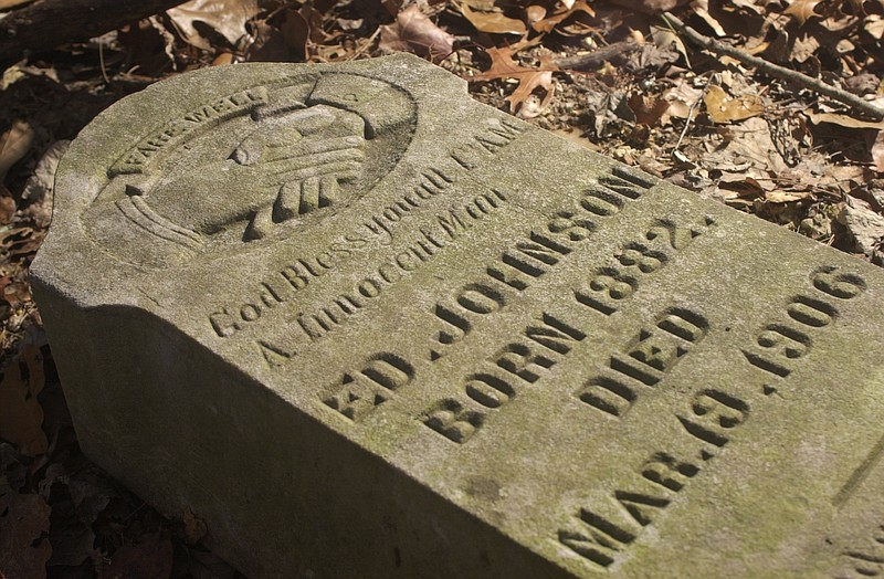 Staff File Photo / The tombstone of 1906 lynching victim Ed Johnson lies in the Pleasant Gardens cemetery on the side of Missionary Ridge.