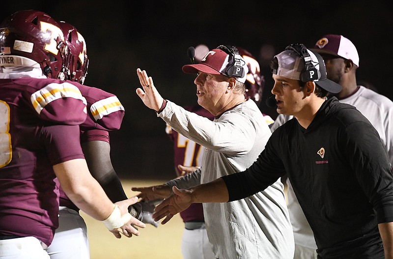 Staff file photo by Robin Rudd / Christian Mainor, right, Tyner's offensive coordinator the past two seasons, has been promoted to head football coach of the Rams.