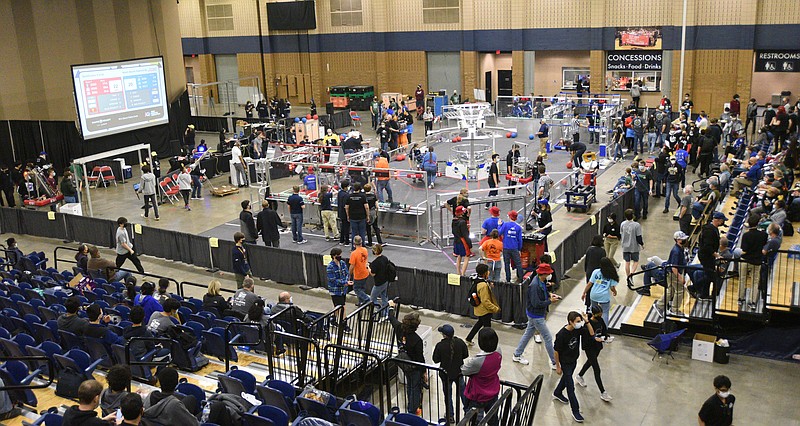 Staff Photo by Matt Hamilton / Teams in groups of three compete to put balls through nets and other tasks during the 2022 Georgia First Robotics Peachtree District qualifier robotics competition at the Dalton Convention Center.