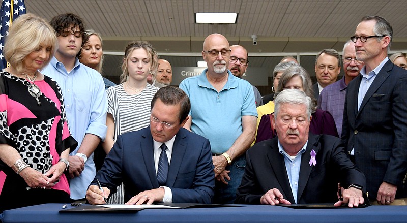Staff Photo by Robin Rudd / Tennessee House Speaker Cameron Sexton, front row, left, and Lt. Gov. Randy McNally, front row, right, hold a ceremonial bill signing in Chattanooga on June 17. Sexton is supporting a 2023 House amendment that would allow for the creation of charter schools for home-schooled students and charter alternative schools.