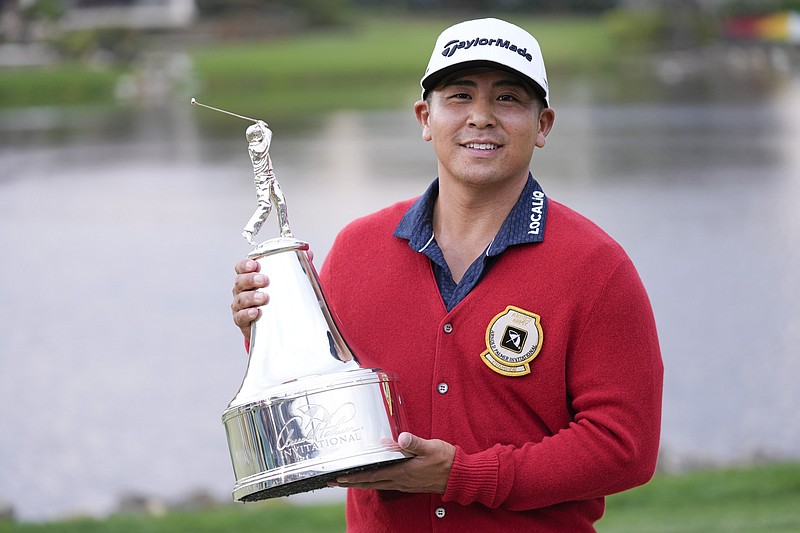 AP photo by John Raoux / Kurt Kitayama holds his trophy after winning the Arnold Palmer Invitational on Sunday at Bay Hill Club in Orlando, Fla. It's the first PGA Tour victory for the 30-year-old American.