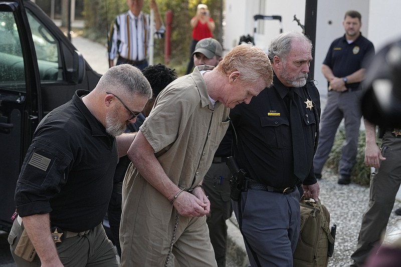 Photo/Chris Carlson/The Associated Press / Alex Murdaugh is led to the Colleton County Courthouse by sheriff's deputies for sentencing in in Walterboro, S.C., on Friday, March 3, 2023, after being convicted of two counts of murder in the June 7, 2021, shooting deaths of his wife and son.