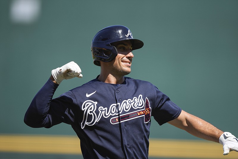 AP photo by Gerald Herbert / Atlanta Braves first baseman Matt Olson celebrates after hitting a two-run homer against the Minnesota Twins during an exhibition game at spring training on Saturday in North Port, Fla.