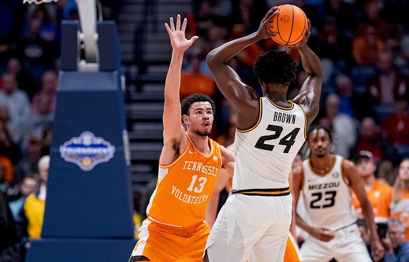 Tennessee Athletics photo / Tennessee senior forward Olivier Nkamhoua guards Missouri senior guard/forward Kobe Brown during Friday afternoon's Southeastern Conference tournament quarterfinal. Brown scored 24 points to help lead the Tigers to a 79-71 victory.