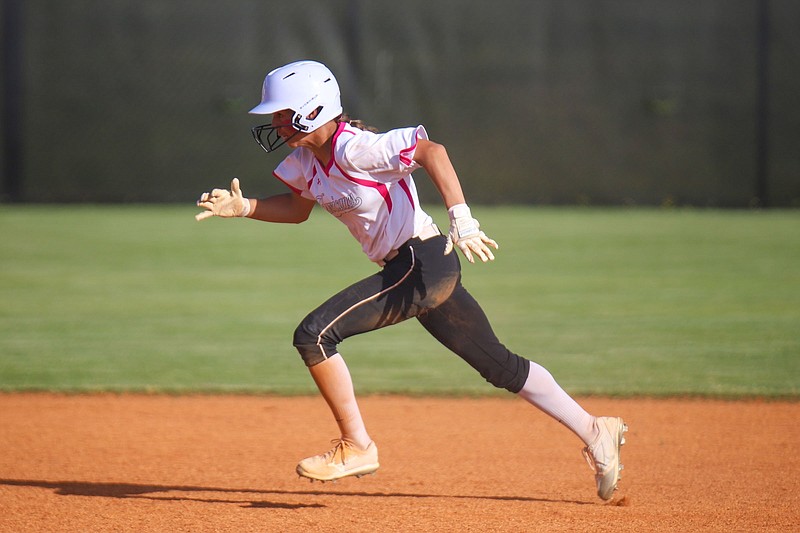 Staff photo by Olivia Ross  / East Hamilton's Reese Knox sprints to third. East Hamilton High School took on Ooltewah at home on April 25, 2022.
