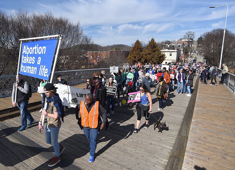 Staff photo by Matt Hamilton / Marchers cross the Walnut Street Bridge during the "March for Life" against abortion sponsored by Greater Chattanooga Right to Life and Students for Life on Saturday, January 28, 2023.