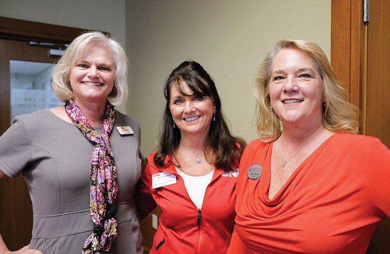 Photography by Mark Gilliland / From left, Lynn Talbott, Elaine Zambos and Jules Parker attend the North Chattanooga Council of the Chattanooga Area Chamber of Commerce's annual Council Expo at the INCubator in March.