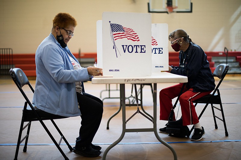 Staff photo by Troy Stolt / Brenda Woodruff and Annie Milner cast their early votes for Chattanooga's Municipal Run-Off Election at the Brainerd Rec. Center on March 24, 2021.