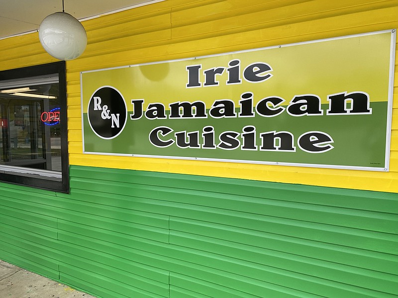 Staff Photo by Barry Courter / A sign for Irie Jamaican Cuisine is seen Monday. The new restaurant is on Dayton Boulevard where a Shuford’s Smokehouse once operated.