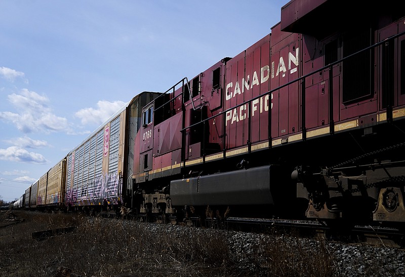 Canadian Pacific trains sit at the main CP Rail train yard in Toronto, March 21, 2022. The first major railroad merger since the 1990s could be approved Wednesday, March 15, 2023, when federal regulators announce their decision on Canadian Pacific's $31 billion acquisition of Kansas City Southern railroad. (Nathan Denette/The Canadian Press via AP)