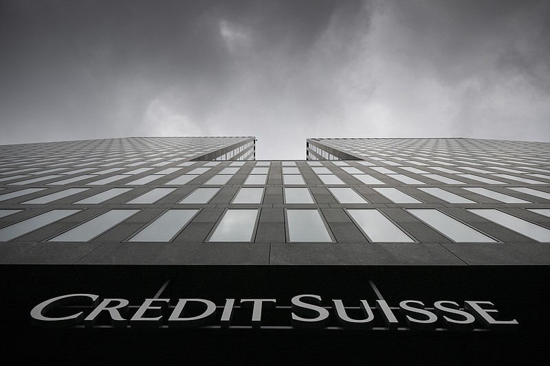 FILE - Grey clouds cover the sky over a building of the Credit Suisse bank in Zurich, Switzerland, on Feb. 21, 2022. Battered shares of Credit Suisse lost more than one-quarter of their value Wednesday March 15, 2023, hitting a record low after its biggest shareholder — the Saudi National Bank — told outlets that it would not inject more money into the ailing Swiss bank. (Ennio Leanza/Keystone via AP, File)