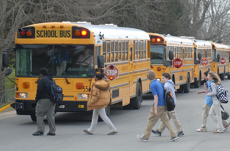 Staff Photo / Cleveland Middle School students board the bus in 2008 after school in Cleveland, Tenn.