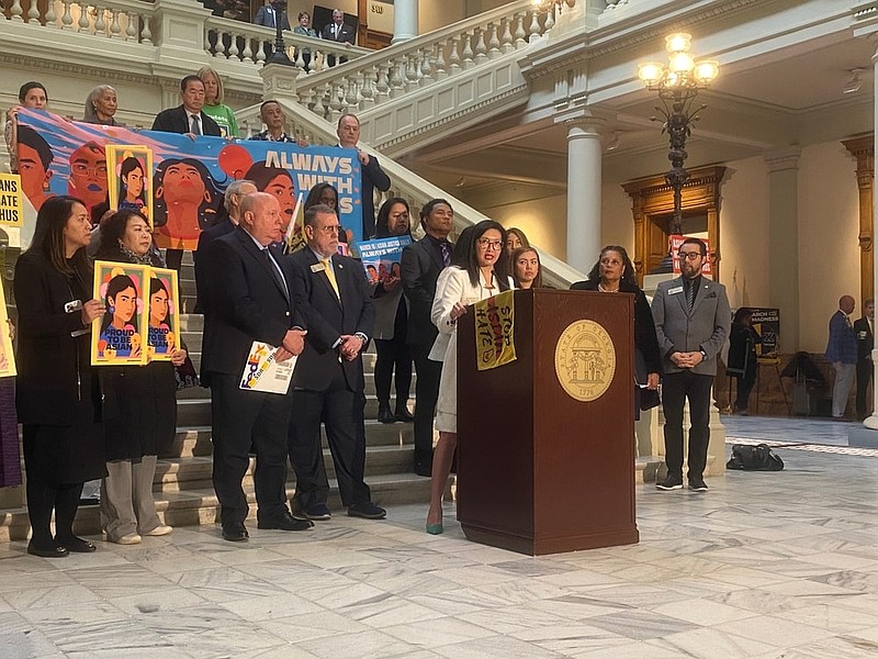 Georgia Public Broadcasting / Rep. Michelle Au, D-Johns Creek, speaks at the Georgia State Capitol on Thursday, two years after six Asian women and two others were shot and killed in spa shootings in 2021.