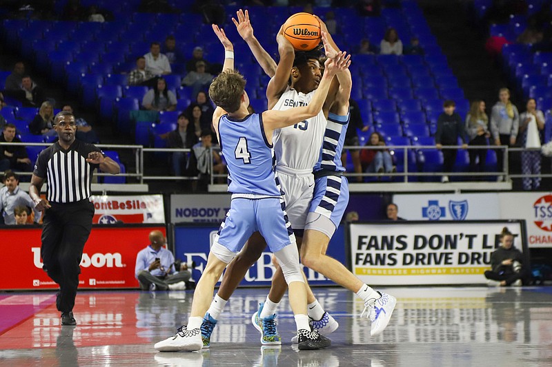 Staff photo by Olivia Ross  / Chattanooga Prep's Eli Gaines (15) is trapped by Hampton's Michael Anspaugh (4) and Dylan Trivett during a TSSAA Class 1A semifinal Friday at the BlueCross Basketball State Championships in Murfreesboro, Tenn.