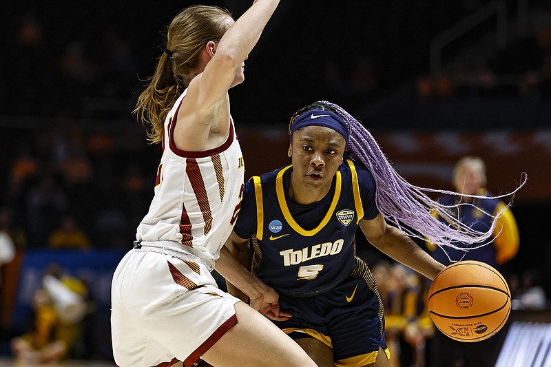 AP photo by Wade Payne / Toledo's Quinesha Lockett drives against Iowa State guard Lexi Donarski during an NCAA tournament first-round game Saturday in Knoxville.