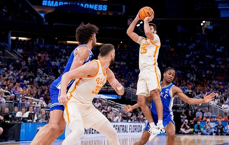 Tennessee Athletics photo / Tennessee senior forward Uros Plavsic positions himself for the rebound as Vols senior guard Santiago Vescovi goes up for a shot during Saturday's 65-52 NCAA tournament win over Duke in Orlando.