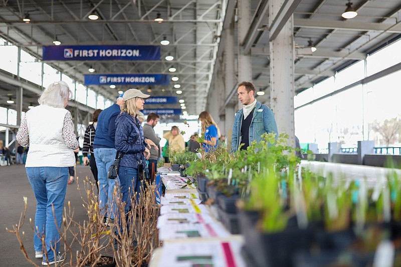 Staff file photo by Olivia Ross  / Reflection Riding Arboretum & Nature Center sell a variety of plants at their booth at the Native Plant Sale & Expo, presented by the Tennessee Valley Chapter of Wild Ones on March 19, 2022.