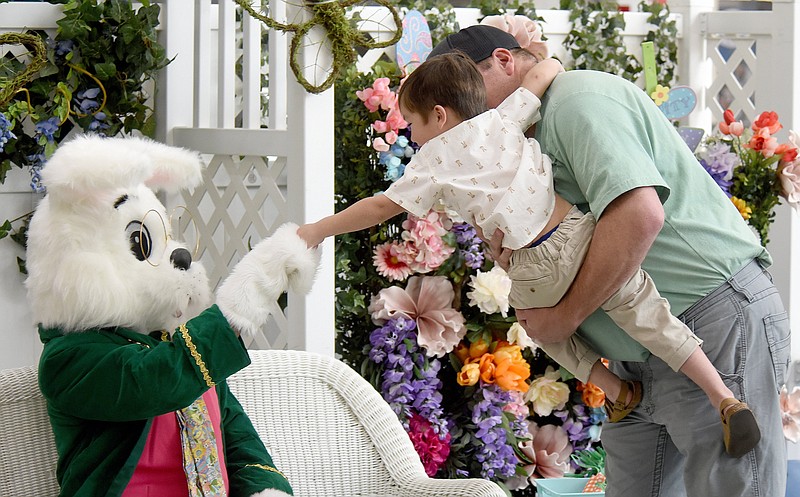 Staff Photo by Matt Hamilton / Whitwell, Tenn., resident John Potts shows his son Jacob, 3, he doesn’t need to be afraid of the Easter Bunny during a photo session March 20 at Northgate Mall. The last day for photos at the Hixson mall will be April 8.