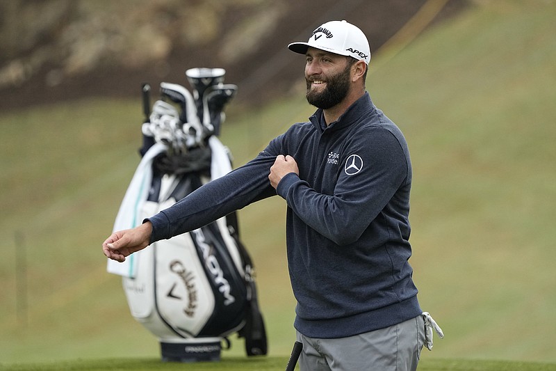 Jon Rahm, of Spain, looks at his shot on the 18th hole during a practice round for the Dell Technologies Match Play Championship golf tournament in Austin, Texas, Tuesday, March 21, 2023. (AP Photo/Eric Gay)