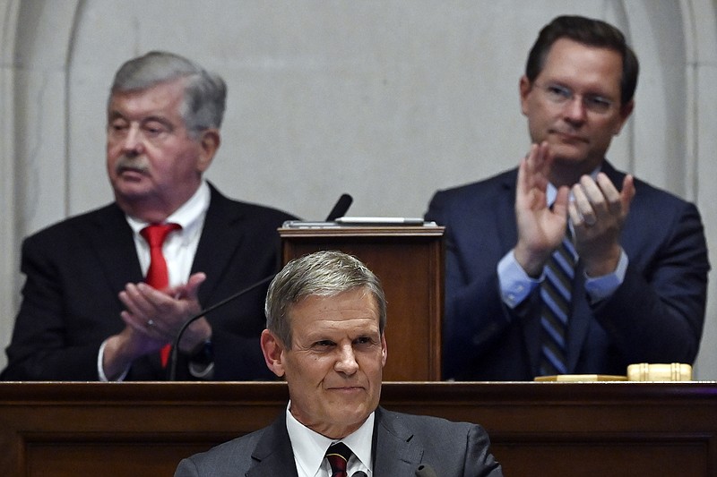Photo/Mark Zaleski/The Associated Press / Legislators applaud Tennessee Republican Gov. Bill Lee as he delivers his State of the State Address in the house chamber on Monday, Feb. 6, 2023, in Nashville, Tenn. In back at left is Republican Lt. Gov. Randy McNally and at right is Republican House Speaker Cameron Sexton.