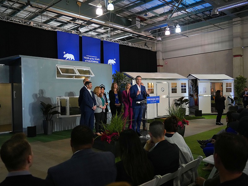 Photo/Jim Wilson/The New York Times / Gov. Gavin Newsom speaks about homelessness while standing in front of prototypes of tiny homes in Sacramento, Calif., on Thursday, March 16, 2023.
