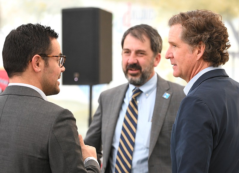 Staff Photo by Robin Rudd /  From left, Hamilton County Mayor West Wamp, Hamilton County Schools Superintendent Justin Robertson and Chattanooga Mayor Tim Kelly talk after the announcement.