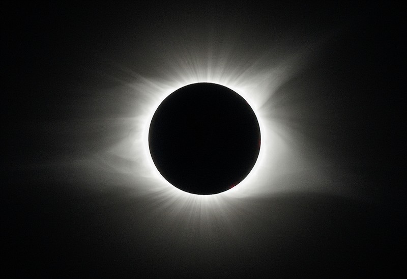 Staff Photo / The solar eclipse is shown in progress in 2017, as seen in Spring City, Tenn.