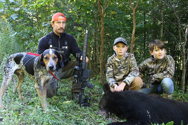 Photo contributed by Larry Case / Kish Justice, Cade Clemons and Anse Justice are carrying on the tradition of bear hunting with hounds in the mountains of West Virginia.