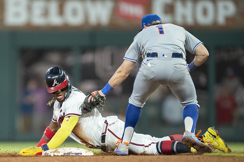 AP photo by Atlanta Braves / The Atlanta Braves' Ronald Acuña Jr. is tagged out by New York Mets second baseman Jeff McNeil during an August matchup between the NL East rivals in Atlanta. The Braves and Mets were both 101-game winners last season, but Atlanta came out on top in the head-to-head tiebreaker to win its fifth straight division title.