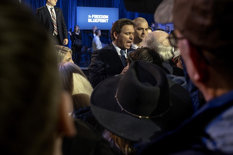 Photo/Jordan Gale/The New York Times / Florida Gov. Ron DeSantis signs copies of his book at the Iowa State Fairgrounds in Des Moines, Iowa on March 10, 2023. DeSantis, on Tucker Carlson’s Fox News show, broke with Republicans to attack President Biden’s foreign policy and align more closely with Donald Trump as he weighs a presidential bid.