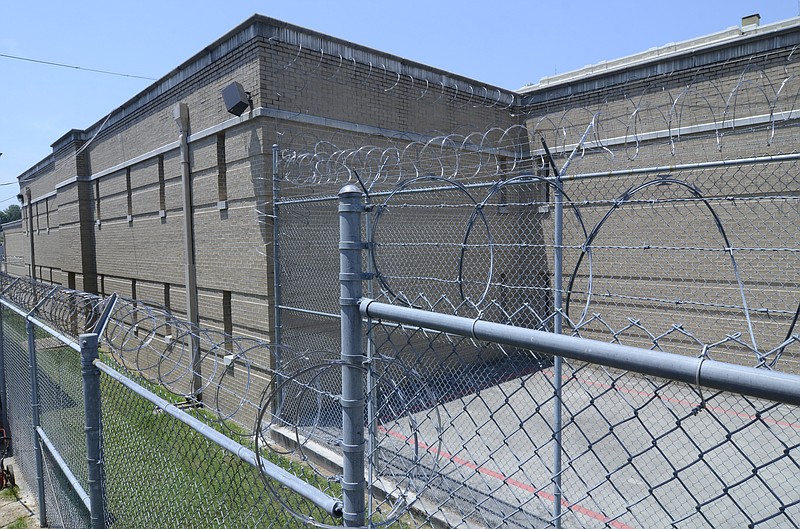 Staff File Photo / Razor wire tops the fences surrounding the Walker County Jail.