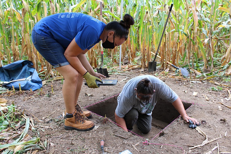 TVA / Tribal members work with TVA staff to perform an archaeological survey at a cornfield in 2021.