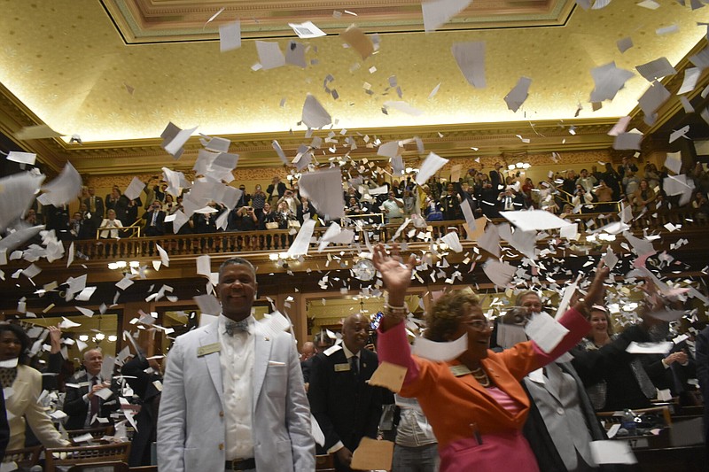 Lawmakers throw bunches of paper to celebrate the end of the 2023 legislative session at the Georgia Capitol. / Georgia Recorder photo by Ross Williams