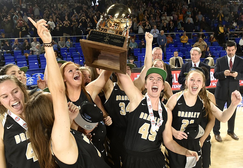 Staff photo by Robin Rudd / Hannah Lombard (45) and her Bradley Central basketball teammates celebrate with the state championship trophy after the Bearettes beat Houston 46-44 in the TSSAA Class AAA final in March 2019. It was the sixth state title in program history, and the Bearettes added their seventh last month.