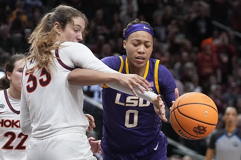 AP photo by Darron Cummings / Virginia Tech's Elizabeth Kitley, left, and LSU's LaDazhia Williams go after a loose ball during an NCAA tournament Final Four game Friday night in Dallas.