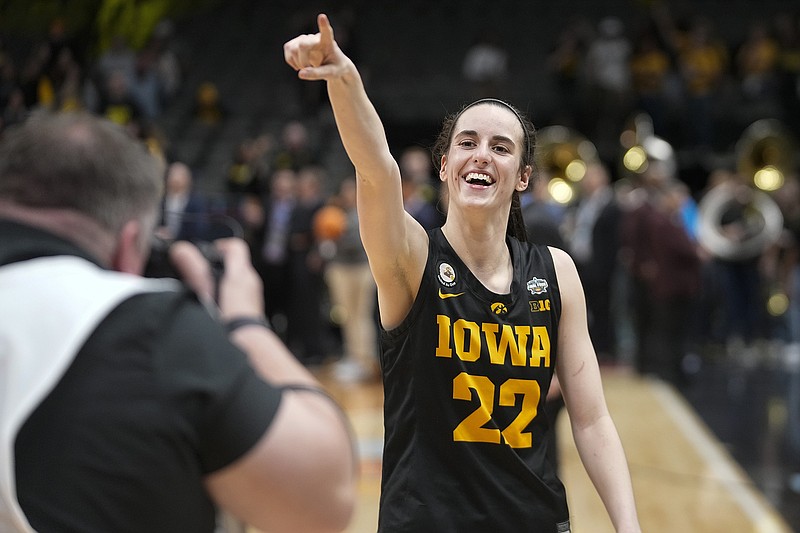 AP photo by Darron Cummings / Iowa guard Caitlin Clark celebrates after scoring 41 points to lead the Hawkeyes past NCAA tournament overall No. 1 seed South Carolina in the Final Four on Friday night in Dallas.