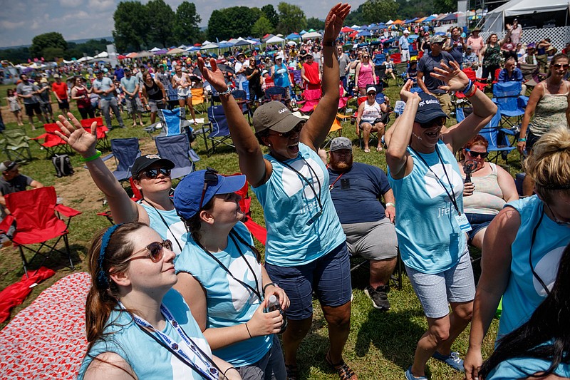 Staff photo by Doug Strickland / 
Fans dance as The Young Escape performs during the Jfest Christian music festival in its new location at the Tennessee Riverpark on Saturday, May 18, 2019, in Chattanooga. After outgrowing its Camp Jordan venue, the annual festival moved to the larger area along the Tennessee River.